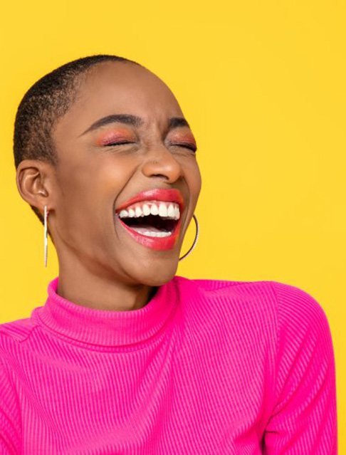 Woman laughing and smiling brightly